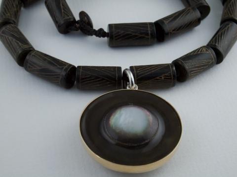 Carved Mother of Pearl set in Gold and Silver on engraved beads