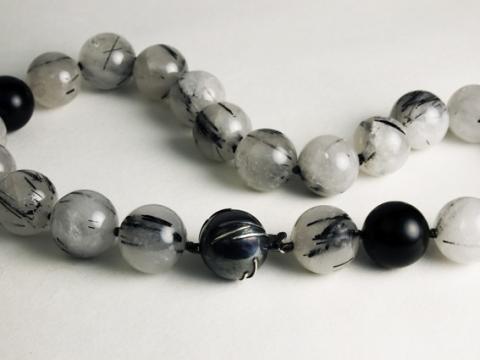Quartz beads with Tourmaline inclusions and Silver clasp to reflect the beads.
