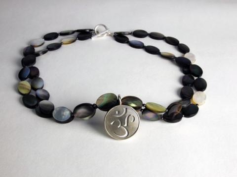 Mother of pearl necklace with Om the first sound of creation